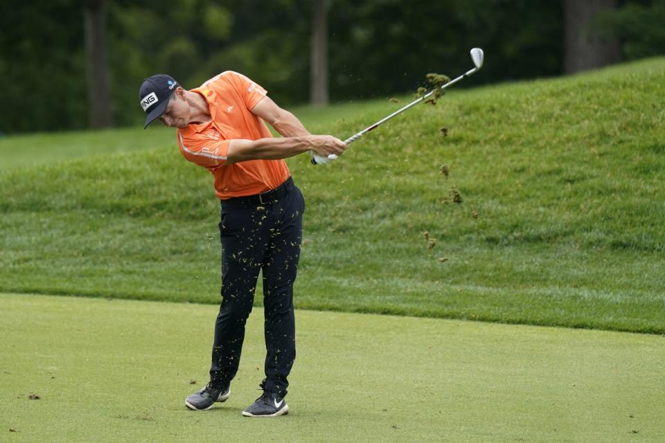 Viktor Hovland swings his club