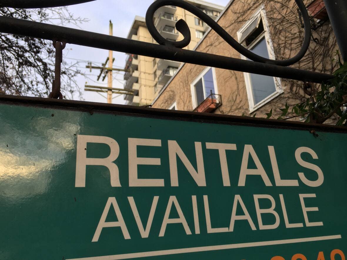 A rental sign is pictured at an apartment building in Vancouver's West End neighbourhood. A former police officer and detective discovered his home was listed on a rentals site by a scammer purporting to rent it out. (David Horemans/CBC - image credit)