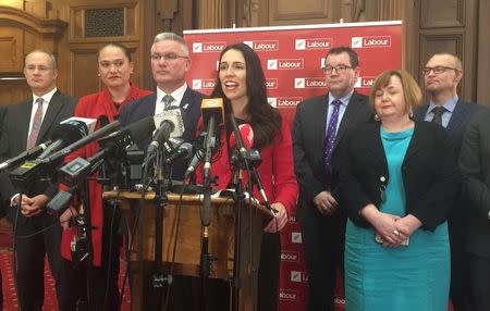 Jacinda Ardern (C), New Zealand's new opposition Labour leader, speaks to the press alongside members of her party after Andrew Little stepped down in Wellington, New Zealand, August 1, 2017. REUTERS/Charlotte Greenfield