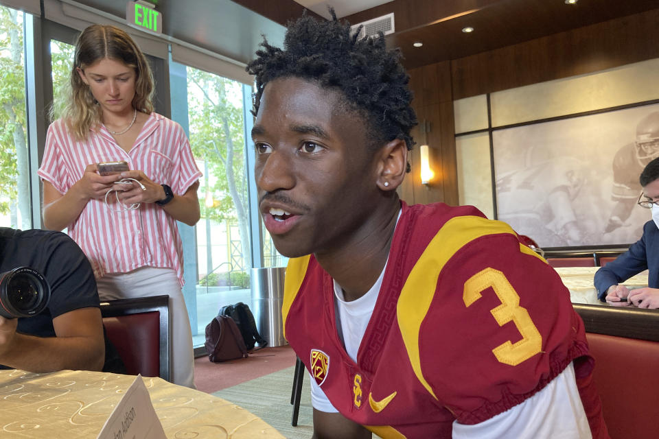 FILE - Southern California receiver Jordan Addison speaks with reporters on the school's campus in Los Angeles on Thursday, Aug. 4, 2022. Addison won the Biletnikoff Award as the nation's top receiver last season at Pittsburgh before his high-profile transfer to the Trojans. (AP Photo/Greg Beacham, File)