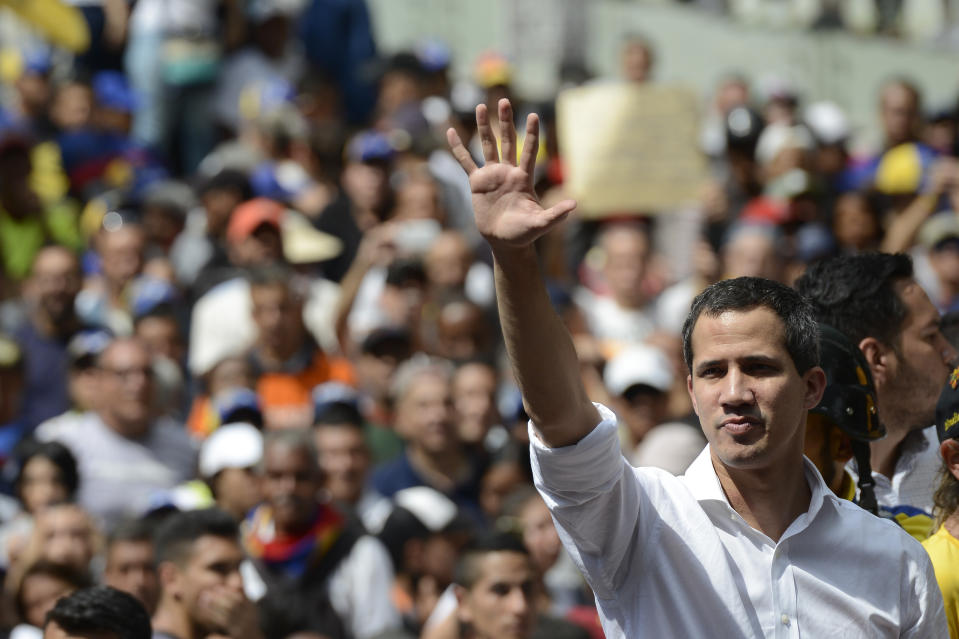 Opposition politician Juan Guaido greets supporters at an anti-government rally, in Caracas, Venezuela, Saturday, Nov. 16, 2019. Guaido called nationwide demonstrations to re-ignite a campaign against President Nicolas Maduro launched in January that has lost steam in recent months. (AP Photo/Matias Delacroix)
