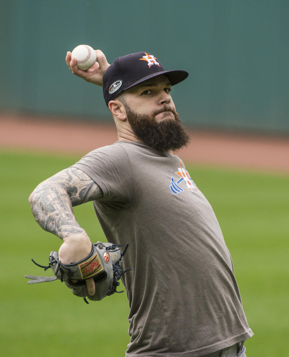 Houston Astros starting pitcher Dallas Keuchel throws during a workout in Cleveland, Sunday, Oct. 7, 2018. Keuchel is scheduled to start against the Cleveland Indians in the third game of their ALDS series, Monday. (AP Photo/Phil Long)