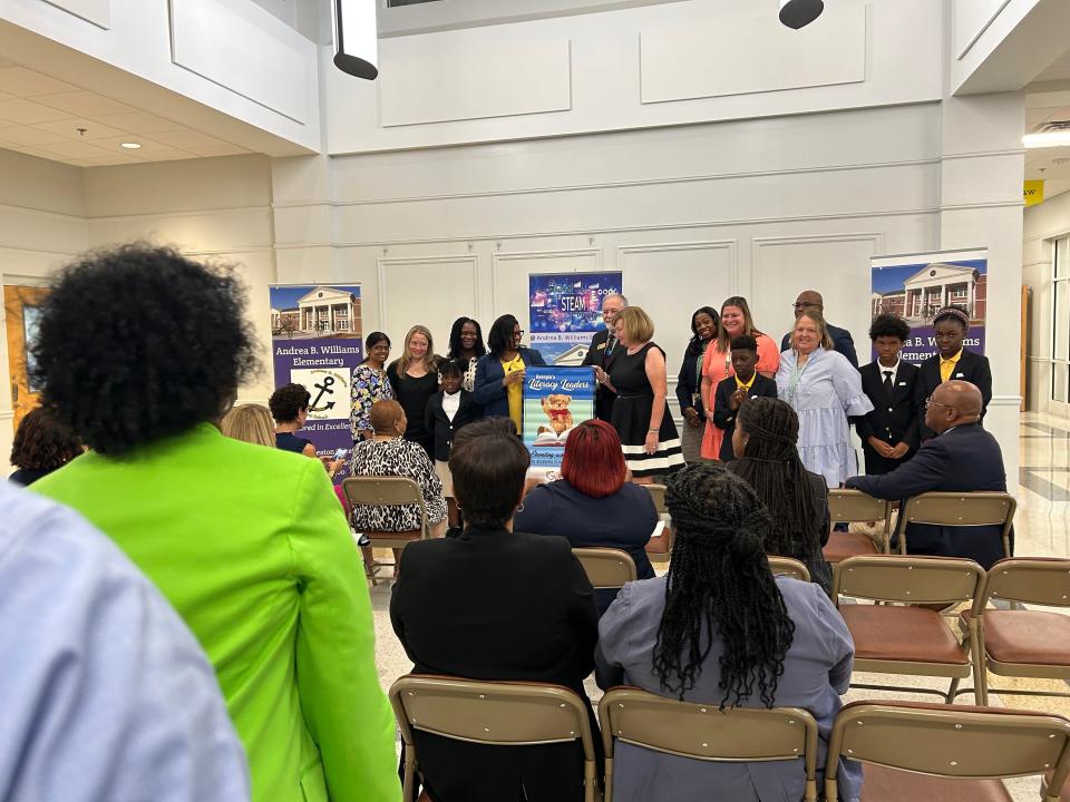 GA State Superintendent Richard Woods presents a Literacy Banner to members of Heard Elementary faculty