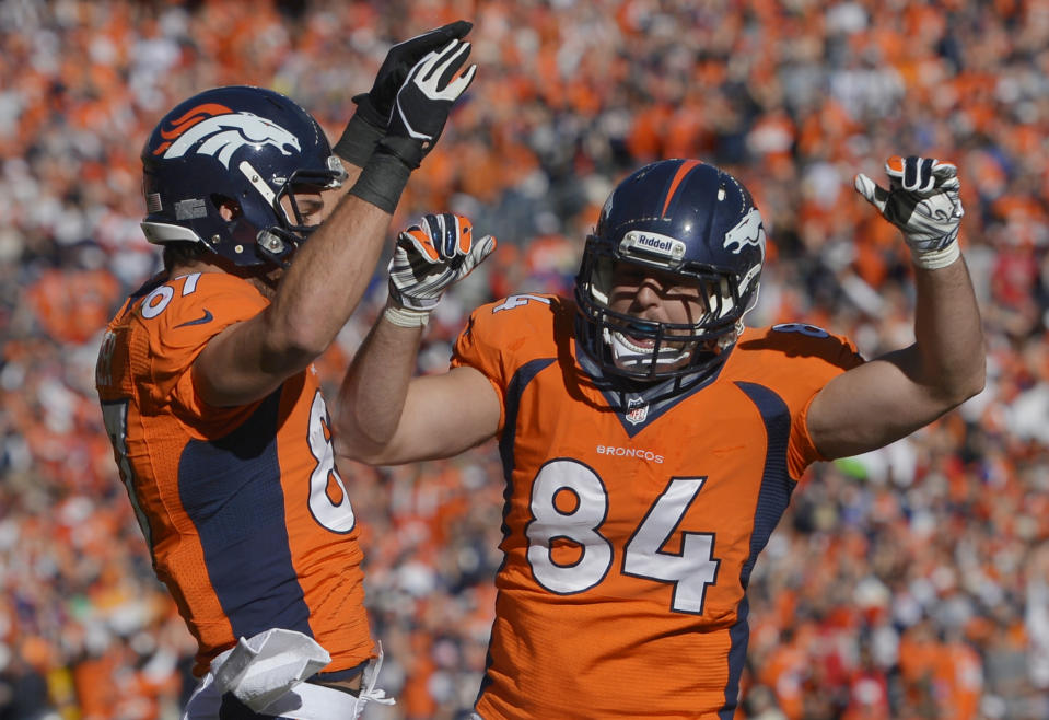 Denver Broncos tight end Jacob Tamme (84) celebrates his touchdown with teammate Denver Broncos wide receiver Eric Decker (87) during the first half of the AFC Championship NFL playoff football game in Denver, Sunday, Jan. 19, 2014. (AP Photo/Jack Dempsey)