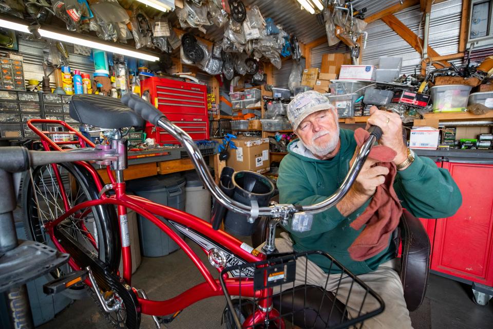 Mike Jones, aka Salvage Santa, takes old bicycles and makes them new again in his workshop on the northeast side of Panama City. Jones donates about 250 bicycles each year to area charities who distribute them to children for Christmas. Jones polishes up the chrome on a bicycle he had just repaired.