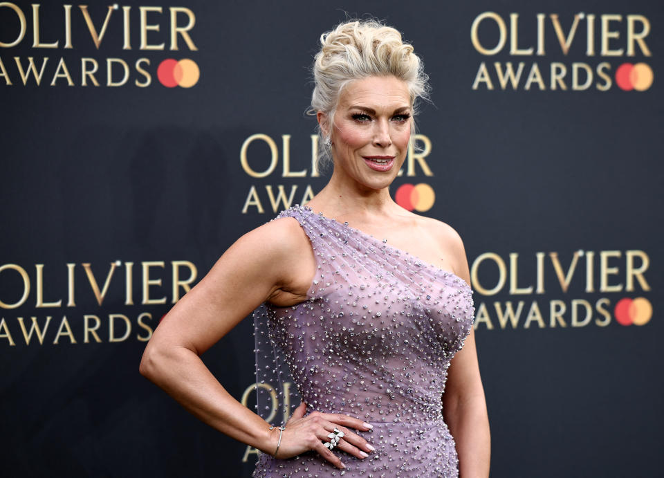 Hannah Waddingham poses on the green carpet upon arrival to attend The Olivier Awards