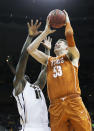 KANSAS CITY, MO - MARCH 09: Ricardo Ratliffe #10 of the Missouri Tigers tries to block a shot by Clint Chapman #53 of the Texas Longhorns during the semifinals of the 2012 Big 12 Men's Basketball Tournament at Sprint Center on March 9, 2012 in Kansas City, Missouri. (Photo by Jamie Squire/Getty Images)