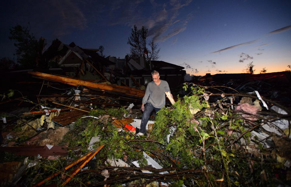 <p>People collect personal effects from damaged homes following a tornado in Dunrobin, Ontario west of Ottawa on Friday, Sept. 21, 2018. A tornado damaged cars in Gatineau, Que., and houses in a community west of Ottawa on Friday afternoon as much of southern Ontario saw severe thunderstorms and high wind gusts, Environment Canada said. (Photo from Sean Kilpatrick/The Canadian Press) </p>