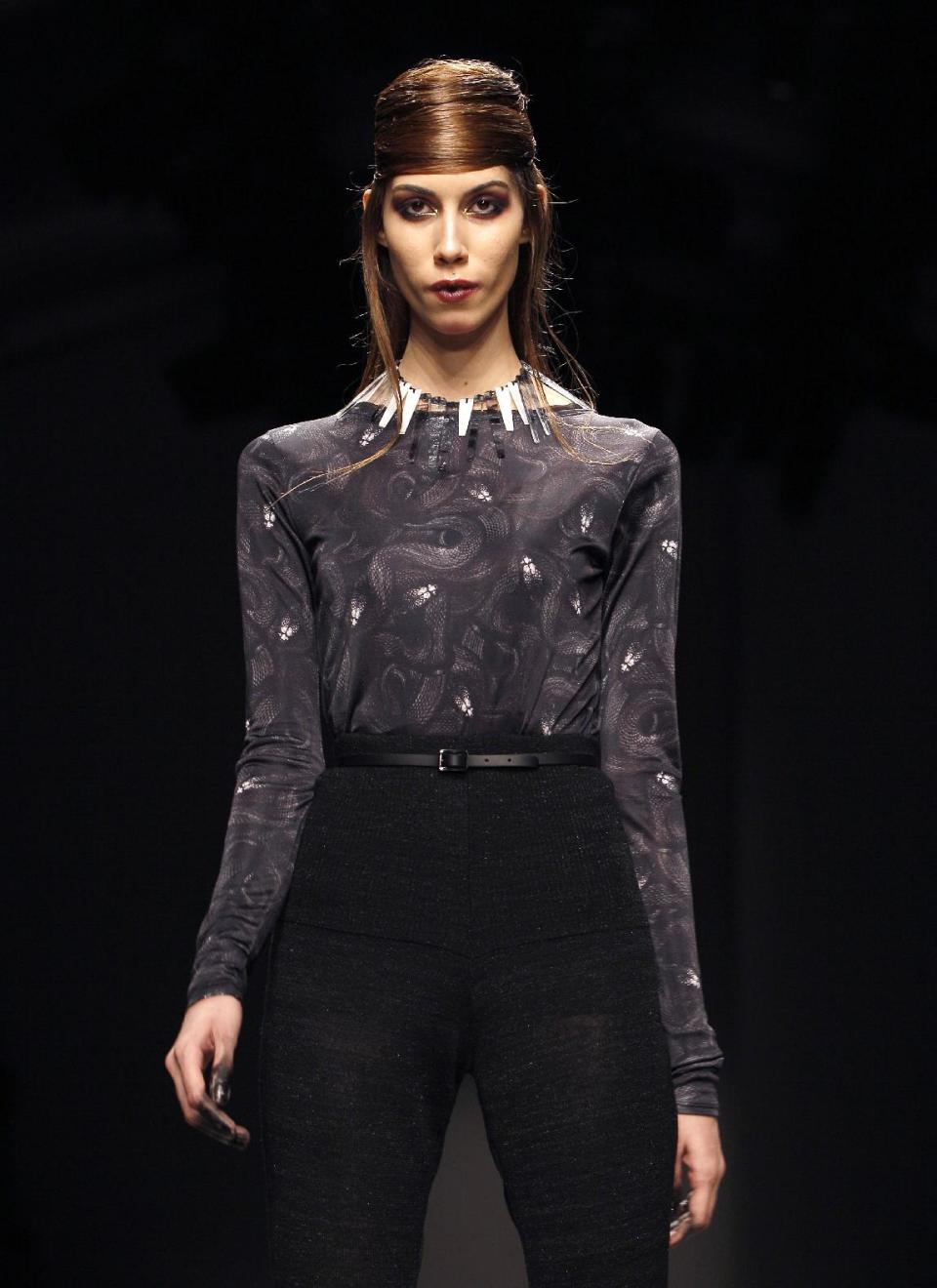 A model displays a creation by designer Aminaka Wilmont during a fashion show at London Fashion Week, Tuesday, Feb. 21, 2012. (AP Photo/Kirsty Wigglesworth)