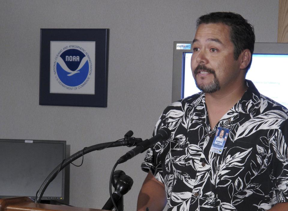 Brian Miyamoto, spokesman for Hawaii State Civil Defense, speaks about preparations for Tropical Storm Flossie during a news conference in Honolulu on Monday, July 29, 2013. A tropical storm making its way toward Hawaii had residents of Maui and the Big Island on Monday bracing for possible flooding, 60 mph wind gusts and waves that could reach as high as 18 feet. Tropical Storm Flossie could also bring mudslides, tornadoes and waterspouts, forecasters said. (AP Photo/Oskar Garcia)
