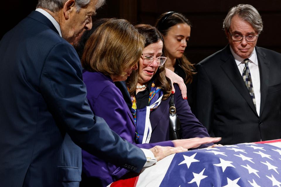 Former U.S. House Speaker Nancy Pelosi comforts her eldest daughter Nancy Prowda as she, alongside her husband Paul Pelosi, Eileen Mariano, granddaughter of Dianne Feinstein, and Rick Mariano, son-in-law of Dianne Feinstein, pay their respects to the late U.S. Senator Dianne Feinstein, D-Calif., as her body lies in state in the Rotunda of City Hall in San Francisco, California, on Oct. 4, 2023.