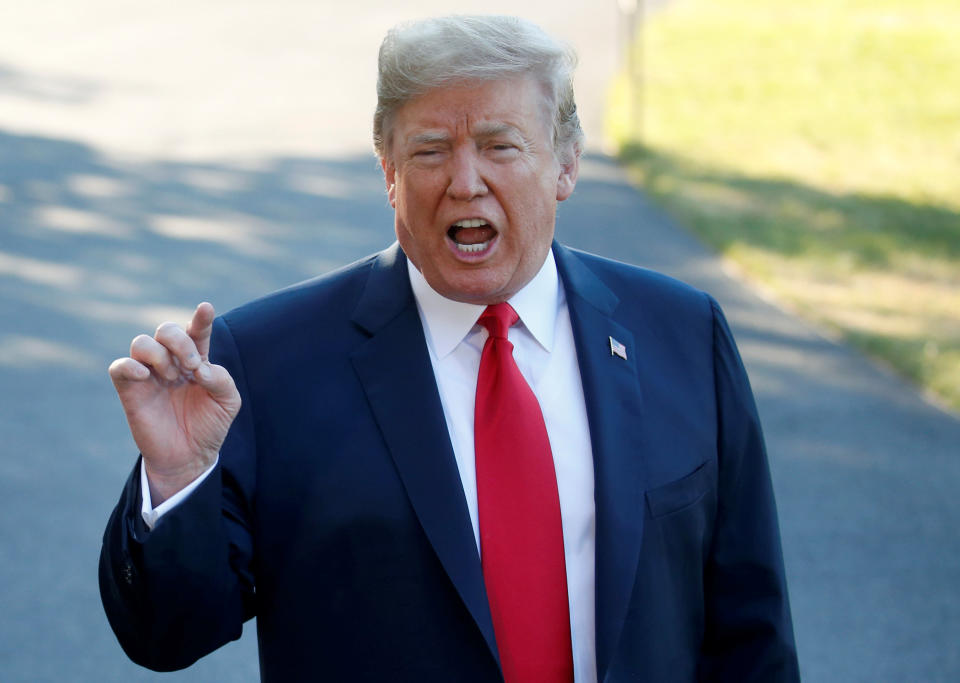 U.S. President Donald Trump speaks with the news media before boarding Marine One for travel to Europe from the White House, in Washington, U.S., July 10, 2018. REUTERS/Leah Millis