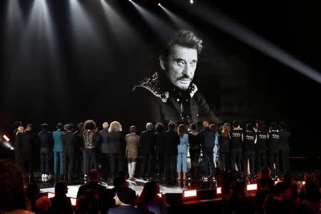 Artists pay tribute to French music icon Johnny Hallyday during the 33rd Victoires de la Musique French music awards ceremony in Paris, France, February 9, 2018. Picture taken February 9, 2018. REUTERS/Benoit Tessier