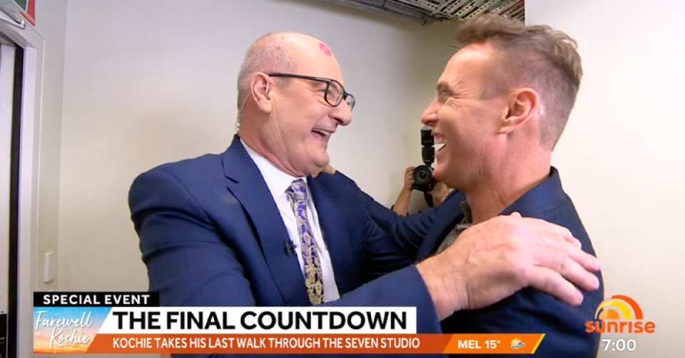 Sunrise’s David ‘Kochie’ Koch hugging Matt Shirvington.