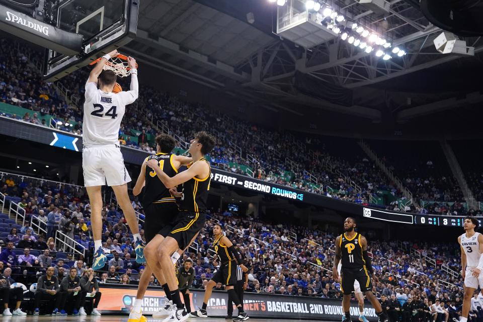 Xavier forward Jack Nunge  finishes an alley-oop dunk in the second half of the Musketeers' 84-73 second-round victory over Pittsburgh last Sunday. The victory set up a showdown between the No. 3 seed Musketeers and the No. 2 seed Texas Longhorns.