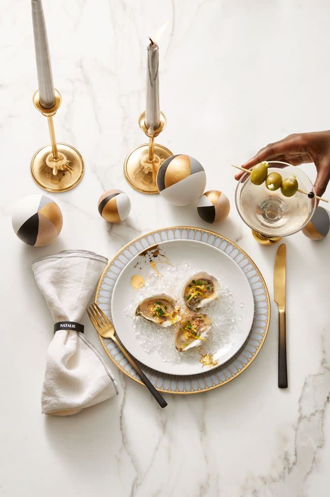 <p>Even if your parties are smaller in scale, you can still make them feel as glamorous as ever with perfectly coordinated place settings, complete with coordinating plates, flatware, and decorative accents in varying heights.</p>