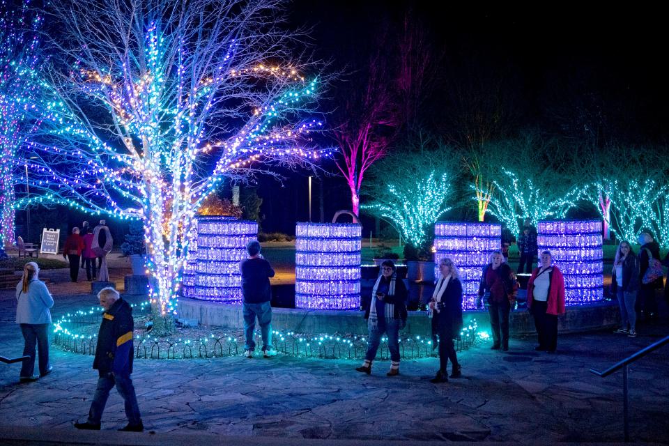 Attendees tour a preview of the Winter Lights display at the North Carolina Arboretum on Nov. 21, 2019.