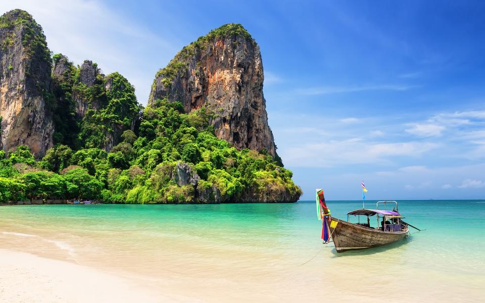 Phuket sits on Thailand's southwest coast, kissed by the Listerine-green Andaman Sea