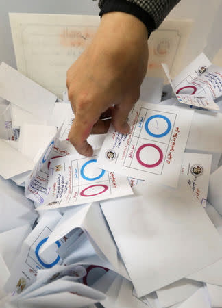 Officials count ballots on the final day of the referendum on draft constitutional amendments, in Cairo, Egypt April 22, 2019. REUTERS/Mohamed Abd El Ghany