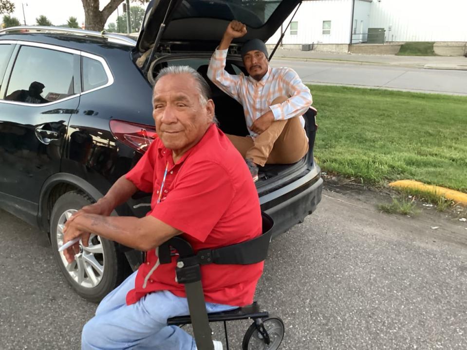 Joseph Circle Bear, a Lakota elder, cultural teacher and spiritual leader, and Michael Toledo prepare for Monday night’s vigil. 