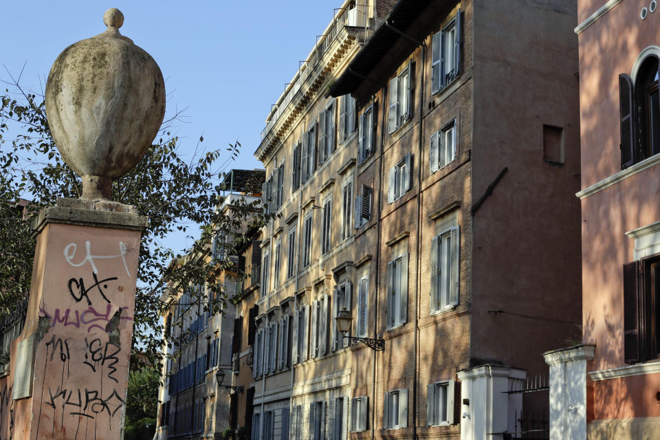 A column is covered by graffiti in Rome's central Via Giulia, Thursday, Nov. 15, 2018. Rome’s monumental problems of garbage and decay exist side-by-side with Eternal City’s glories. (AP Photo/Gregorio Borgia)