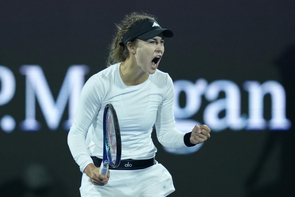 Anna Kalinskaya celebrates after beating Iga Swiatek of Poland during a semi final match of the Dubai Duty Free Tennis Championships in Dubai, United Arab Emirates, Friday, Feb. 23, 2024. (AP Photo/Kamran Jebreili)