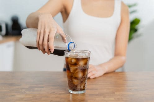 <span class="caption">The sweetener aspartame is found is many common foods and drinks, such as diet sodas. </span> <span class="attribution"><a class="link " href="https://www.shutterstock.com/image-photo/thirsty-asian-young-woman-girl-holding-2105136650" rel="nofollow noopener" target="_blank" data-ylk="slk:Kmpzzz/ Shutterstock;elm:context_link;itc:0;sec:content-canvas">Kmpzzz/ Shutterstock</a></span>