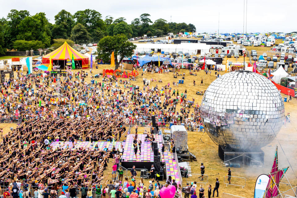 Dancers donned their finest sequins and boogied by a giant disco ball (Victor Frankowski/Camp Bestival/PA)