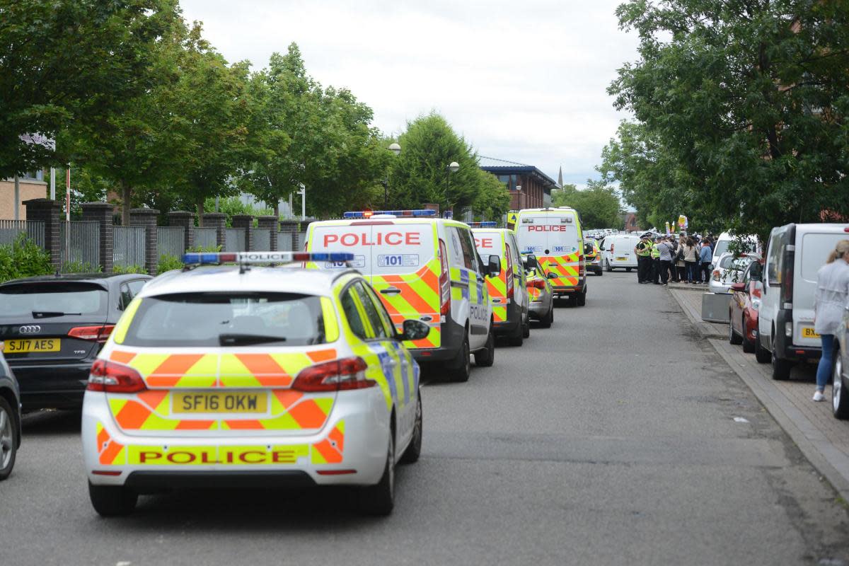 Police cars parked outside the Brand Street immigration centre in Glasgow <i>(Image: SWNS)</i>