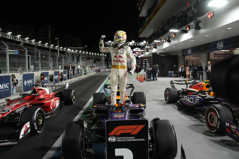 Red Bull driver Max Verstappen, of the Netherlands, stands on top of his car after winning the Formula One Las Vegas Grand Prix auto race, Saturday, Nov. 18, 2023, in Las Vegas. (AP Photo/John Locher)