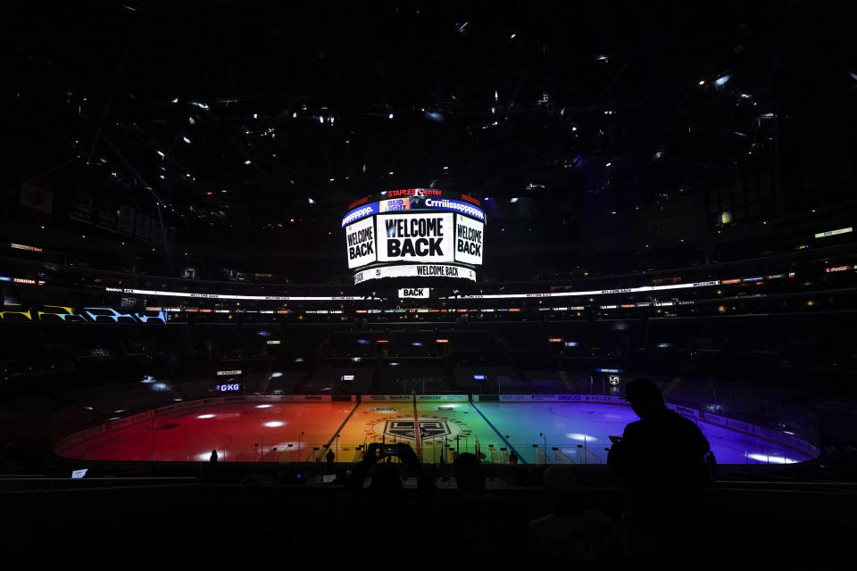 FILE - The ice is lit in rainbow light for Pride Night before an NHL hockey game between the Anaheim Ducks and the Los Angeles Kings, Monday, April 26, 2021, in Los Angeles. The Chicago Blackhawks will not wear Pride-themed warmup jerseys before Sunday's Pride Night game against Vancouver because of security concerns involving a Russian law that expands restrictions on activities seen as promoting LGBTQ rights in the country. (AP Photo/Ashley Landis, File)