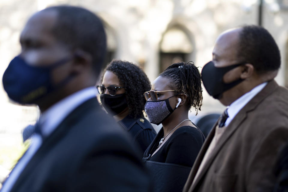 Georgia State Rep. Park Cannon, D-Atlanta,, center, walks beside Martin Luther King, III, as she returns to the State Capitol in Atlanta on Monday morning, March 29, 2021 after being arrested last week for knocking on the governor's office door as he signed voting legislation. (AP Photo/Ben Gray)