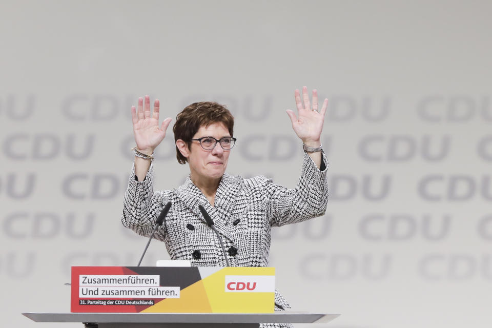 Newly elected party chairwoman Annegret Kramp-Karrenbauer waves after the election at the party convention of the Christian Democratic Democratic Union CDU in Hamburg, northern Germany, Friday, Dec. 7, 2018. (AP Photo/Markus Schreiber)