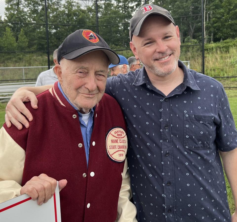 John Cochin, left, is seen here at the ceremony at which a Sanford High School baseball field was dedicated to him on July 14, 2023. At right is York County Coast Star Reporter Shawn Sullivan, a former student and colleague of Cochin's.