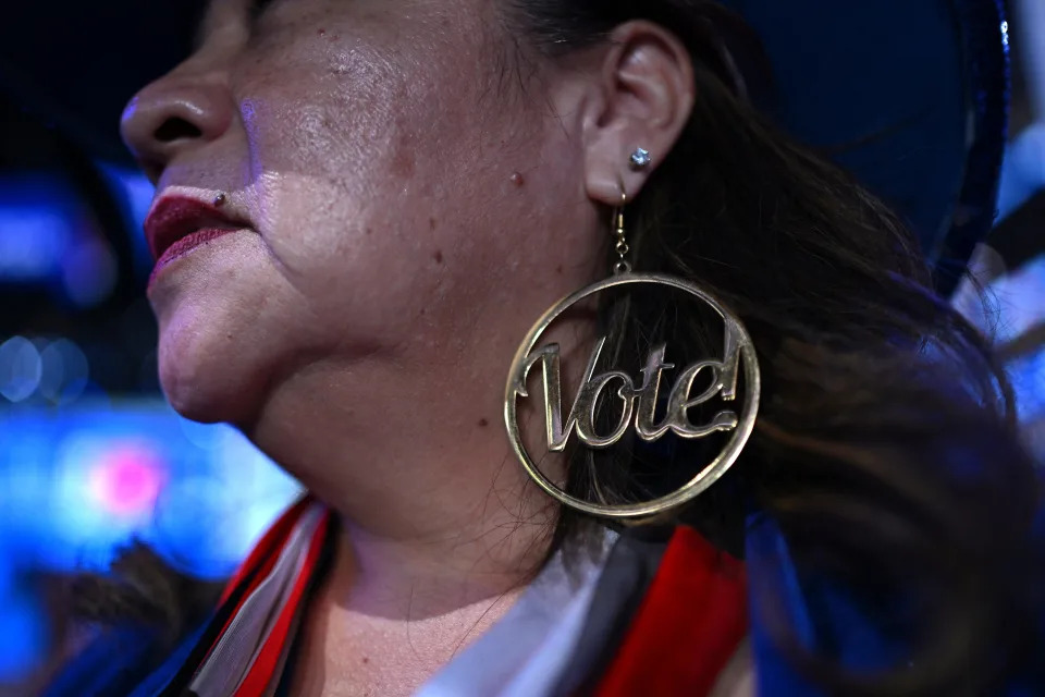 An attendee wears Vote earrings during Day 2 of the Democratic National Convention (DNC) in Chicago, Illinois on August 20, 2024.