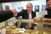 Britain's Prime Minister Boris Johnson visit a bakery during a General Election campaign trail stop in Wells, England, Thursday, Nov. 14, 2019. Britain goes to the polls on Dec. 12. (AP Photo/Frank Augstein, Pool)