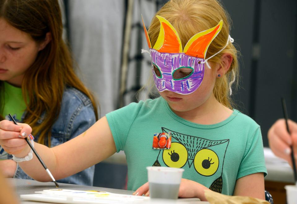 Breanna Hensley,8, creates her own art Sunday during the 23rd annual Gulf Breeze Celebrates the Arts fine arts festival at Gulf Breeze High School.