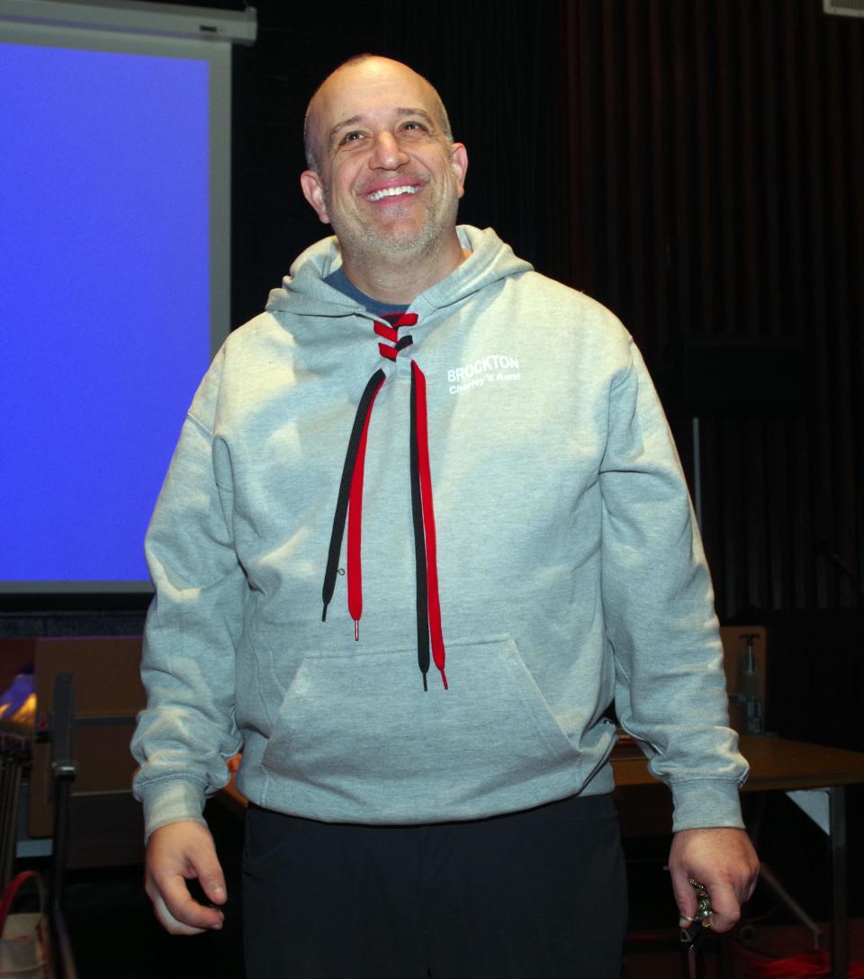 Bob Hogan, director and producer for Brockton High School stage productions, beams with pride on Monday, March 25, 2024, after he officially announces that Brockton is the Massachusetts Educational Theatre Guild State Champion for their production of "Charlie's Uncle."