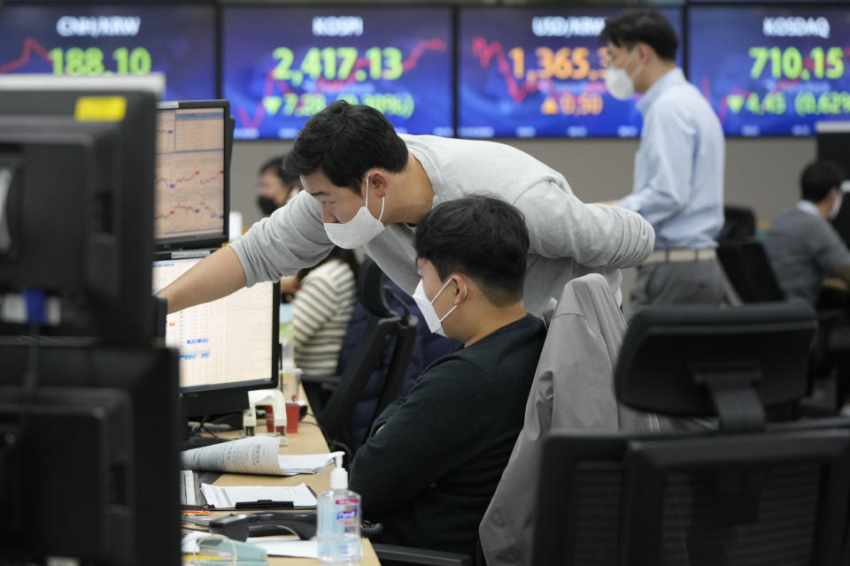 Currency traders watch monitors at the foreign exchange dealing room of the KEB Hana Bank headquarters in Seoul, South Korea, Thursday, Nov. 10, 2022. Asian stock markets followed Wall Street lower on Thursday ahead of a U.S. inflation update that will likely influence Federal Reserve plans for more interest rate hikes after elections left control of Congress uncertain.(AP Photo/Ahn Young-joon)