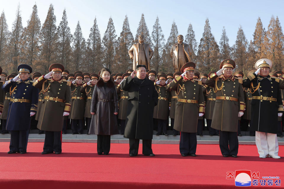 In this photo provided by the North Korean government, its leader Kim Jong Un, center, with his daughter, salutes as they visit the defense ministry for events to celebrate the 76th founding anniversary of the country's army in North Korea, Thursday, Feb. 8, 2024. Independent journalists were not given access to cover the event depicted in this image distributed by the North Korean government. The content of this image is as provided and cannot be independently verified. Korean language watermark on image as provided by source reads: "KCNA" which is the abbreviation for Korean Central News Agency. (Korean Central News Agency/Korea News Service via AP)