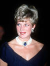 <p>A sapphire brooch was given to the queen mother as a wedding gift, and Princess Diana was frequently photographed wearing it around her neck, held with a string of pearls. The Princess of Wales famously donned the necklace with the “revenge dress” she wore on the very evening it was revealed to the public that Prince Charles had been unfaithful. (Photo: PA) </p>