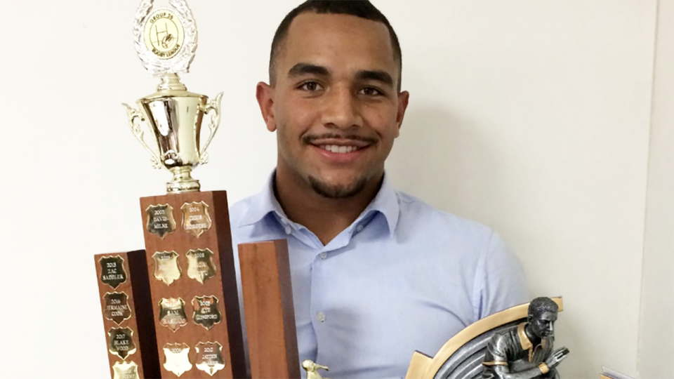 Ziggie Vincent, pictured here with a rugby league trophy.