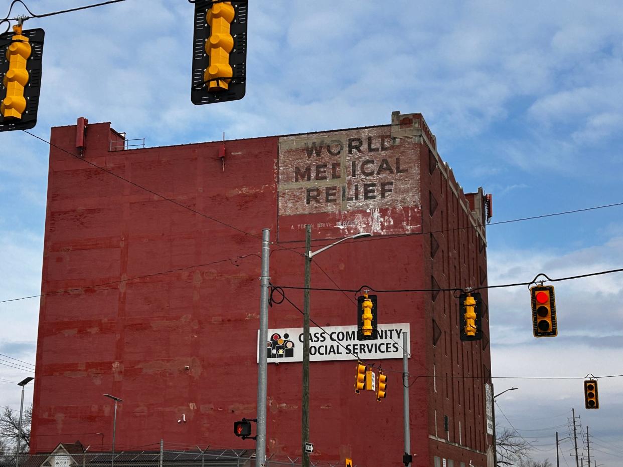 Faded ghost signs for the original World Medical Relief Inc. building still sit atop the structure now housing Cass Community Social Services at 11745 Rosa Parks Boulevard in Detroit.