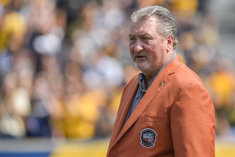 FILE - West Virginia men's basketball coach Bob Huggins is recognized for his induction into the College Basketball Hall of Fame during an NCAA college football game between West Virginia and Towson, Saturday, Sept. 17, 2022, in Morgantown, W.Va. West Virginia's roster underwent a makeover after the Mountaineers finished 16-17 a year ago. With the addition of multiple transfers, coach Bob Huggins says he has more players who he thinks can score baskets. (AP Photo/William Wotring, File)