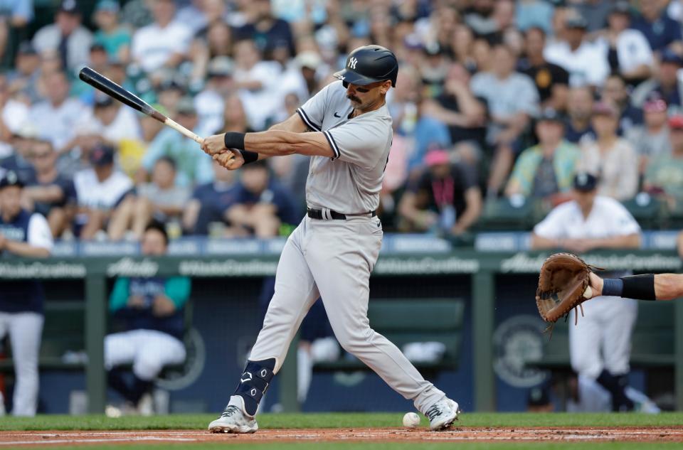 New York Yankees' Matt Carpenter fouls a ball off his foot against the Seattle Mariners during the first inning, Monday, Aug. 8, 2022, in Seattle. He left the game after his at bat. (AP Photo/John Froschauer)