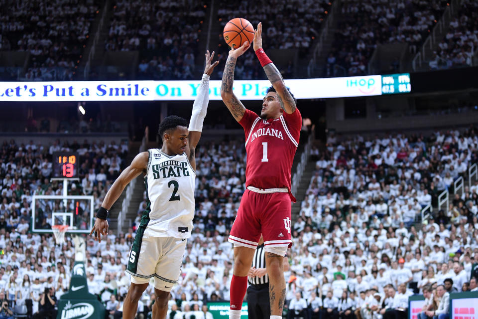 Indiana guard Jalen Hood-Schifino attempts a 3-point shot over Michigan State guard Tyson Walker on Feb. 21, 2023, in East Lansing, Michigan. (Adam Ruff/Icon Sportswire via Getty Images)