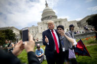 <p>An actor portraying US President Donald J. Trump has his picture made before speaking at an event to call on Trump to release his tax returns outside the U.S. Capitol in Washington, D.C. on April 15, 2017. (Photo: Jim Lo Scalzo/EPA) </p>