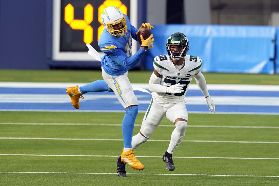 Los Angeles Chargers wide receiver Keenan Allen, left, catches the ball in front of New York Jets cornerback Lamar Jackson during the first half of an NFL football game Sunday, Nov. 22, 2020, in Inglewood, Calif. (AP Photo/Jae C. Hong)