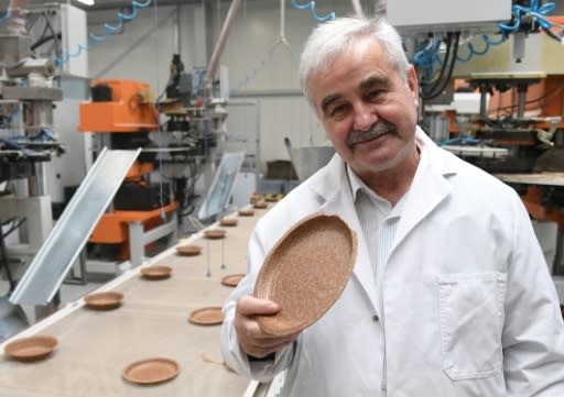 Polish inventor and entrepreneur Jerzy Wysocki holds a wheat bran plate he invented 15 years ago at the Biotrem factory in Zambrow, Poland