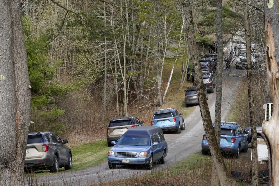A hearse leaves the scene of a shooting, Tuesday, April 18, 2023, in Bowdoin, Maine. (AP Photo/Robert F. Bukaty)